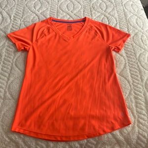 Vibrant orange shirt, Brand is Danskin very good material and cute